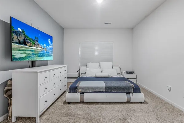 a picture of a bench in front of a white house