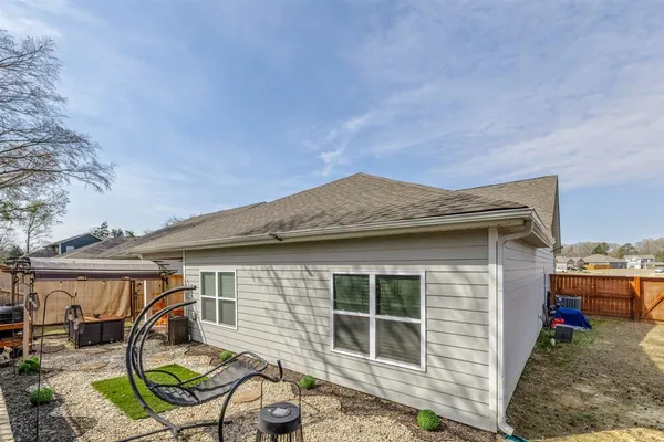 a house view with a backyard space