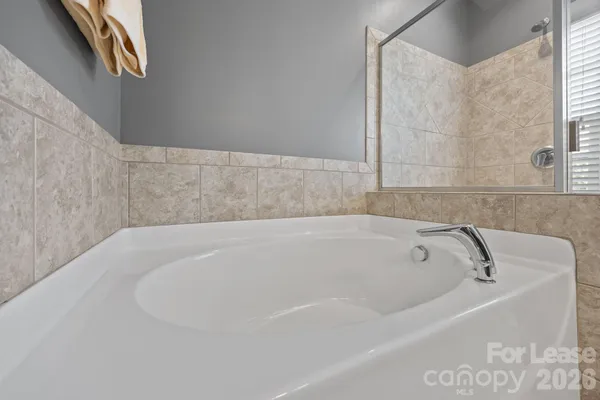 an empty room with ceiling fan