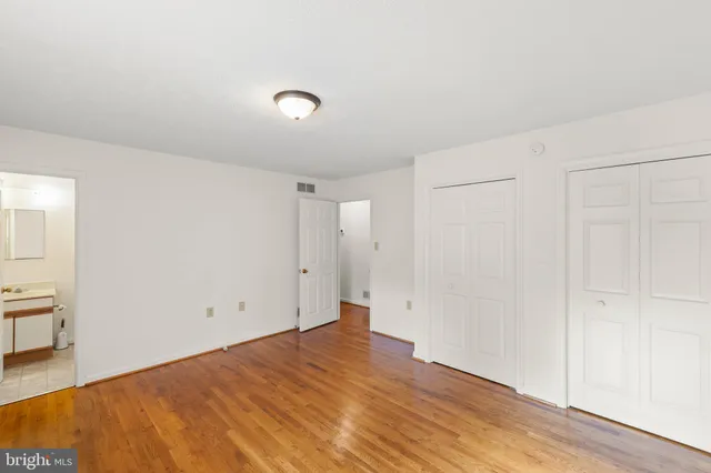 an empty room with wooden floor