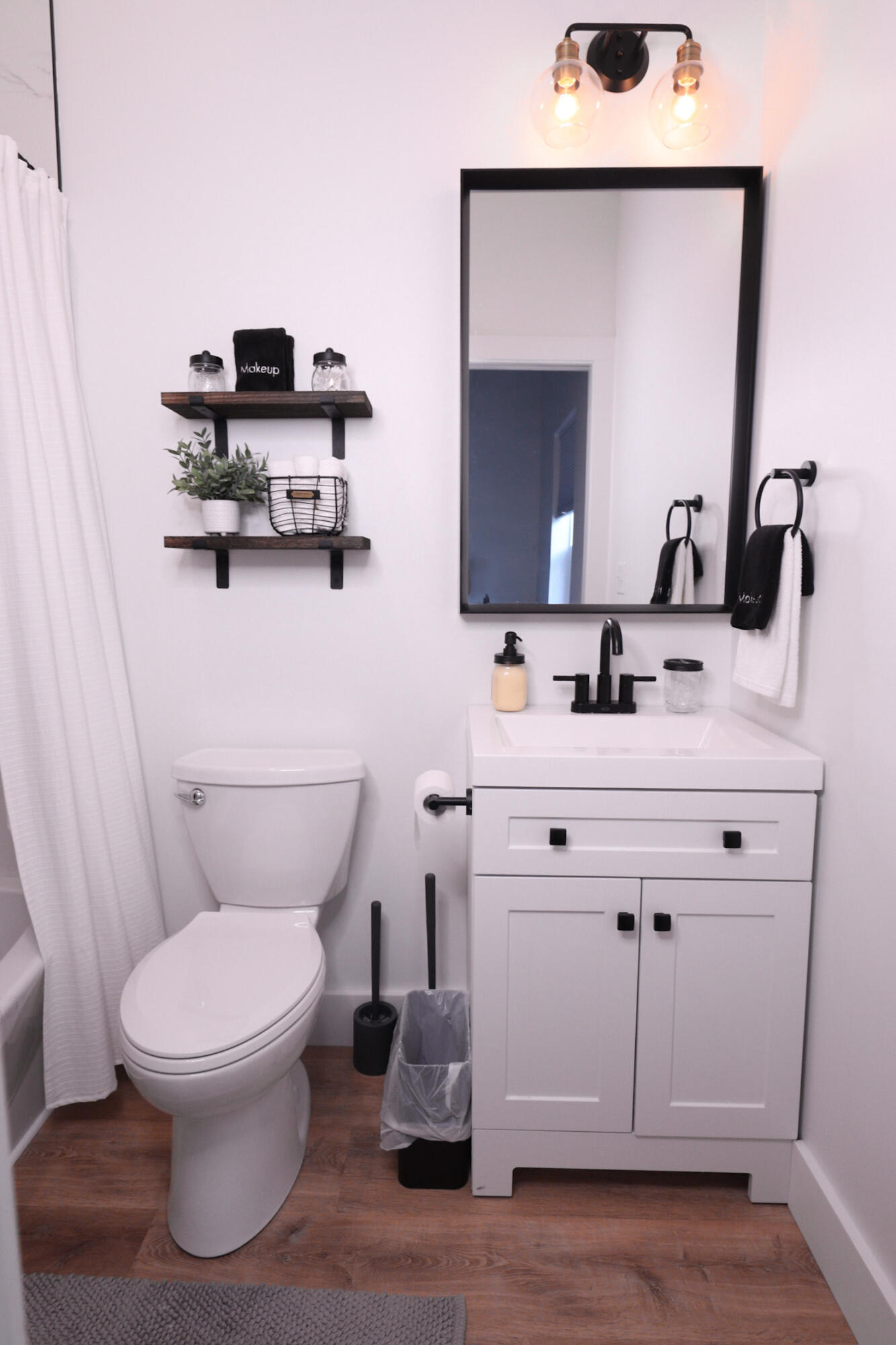 200 11th Street Santa Rosa Beach, FL 32459 - Photo 19 of 29 a bathroom with a toilet sink and mirror