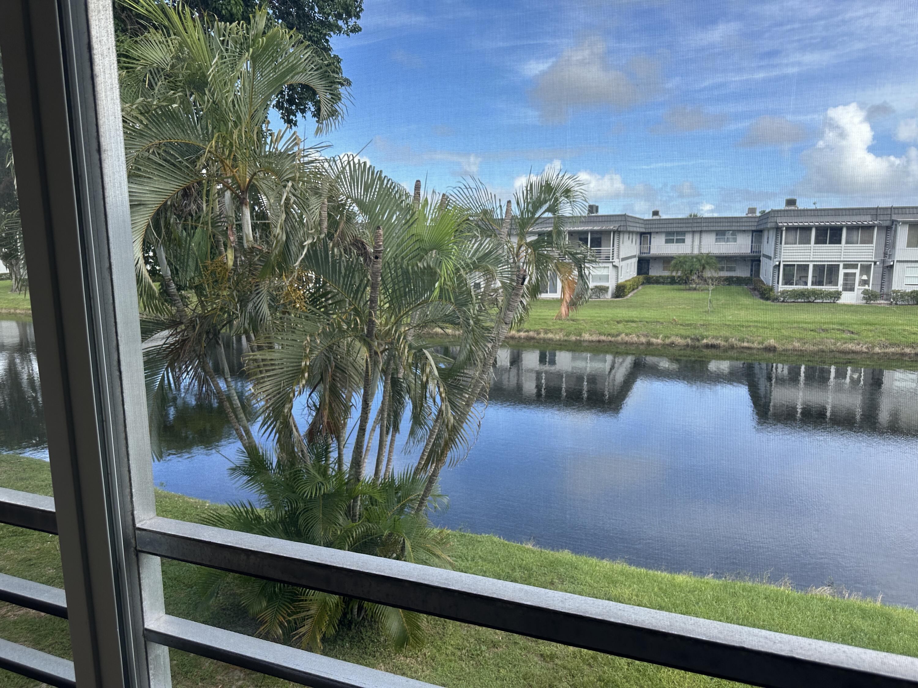 415 Saxony Way Delray Beach, FL 33446 - Photo 16 of 23 a view of a swimming pool with a yard