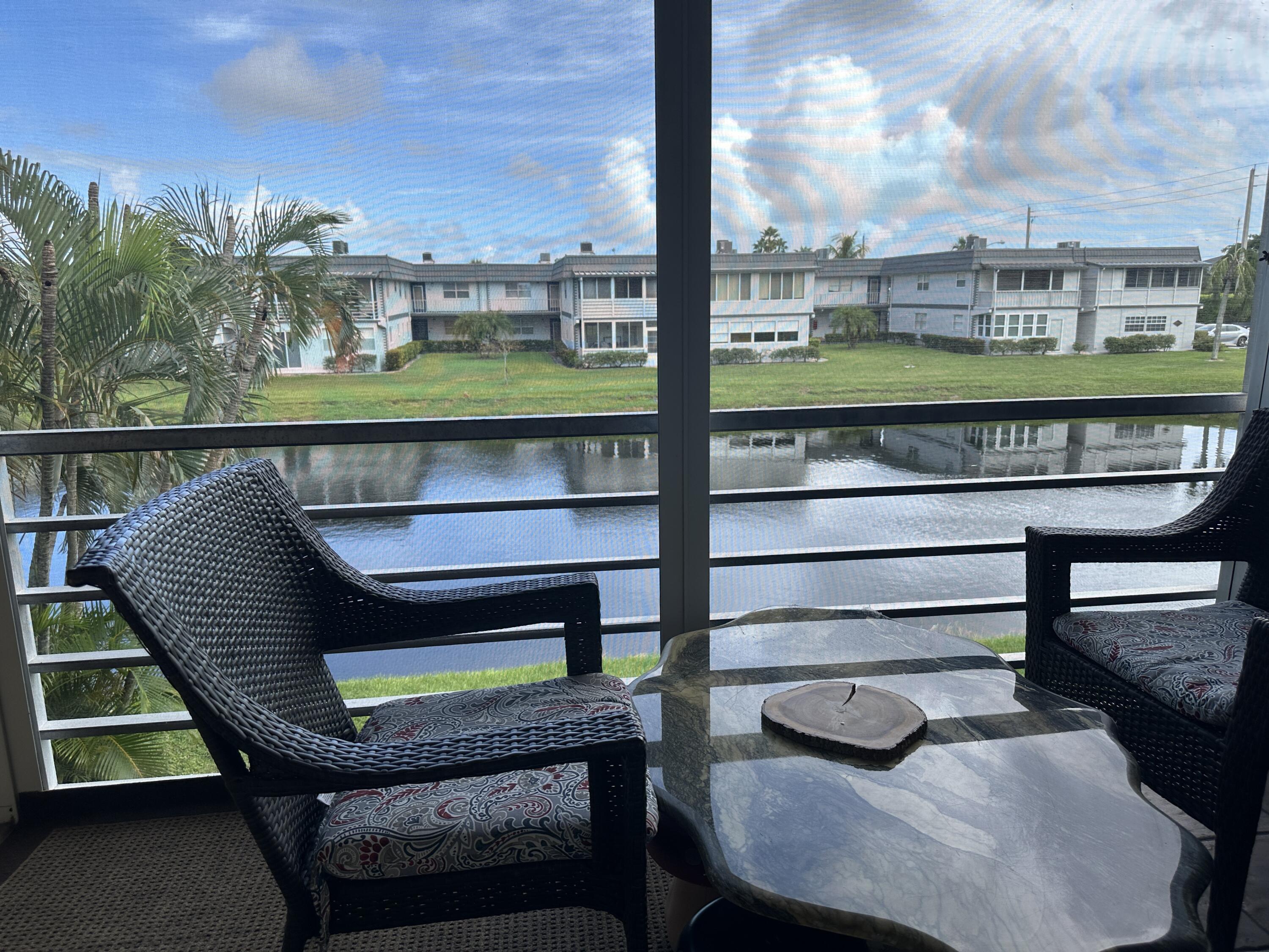 415 Saxony Way Delray Beach, FL 33446 - Photo 17 of 23 a view of a chairs in a balcony
