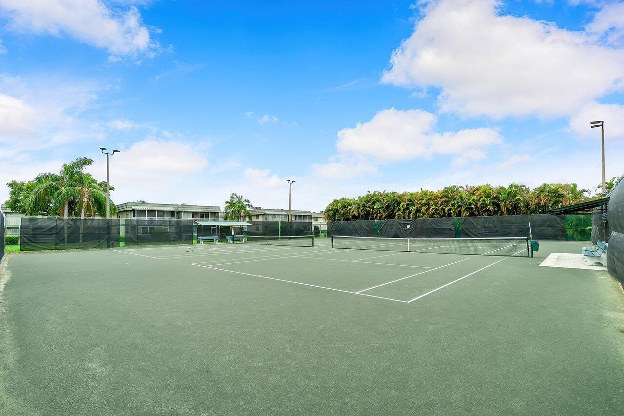 415 Saxony Way Delray Beach, FL 33446 - Photo 21 of 23 a view of an outdoor space and tennis court