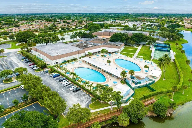 an aerial view of a swimming pool patio and mountain view