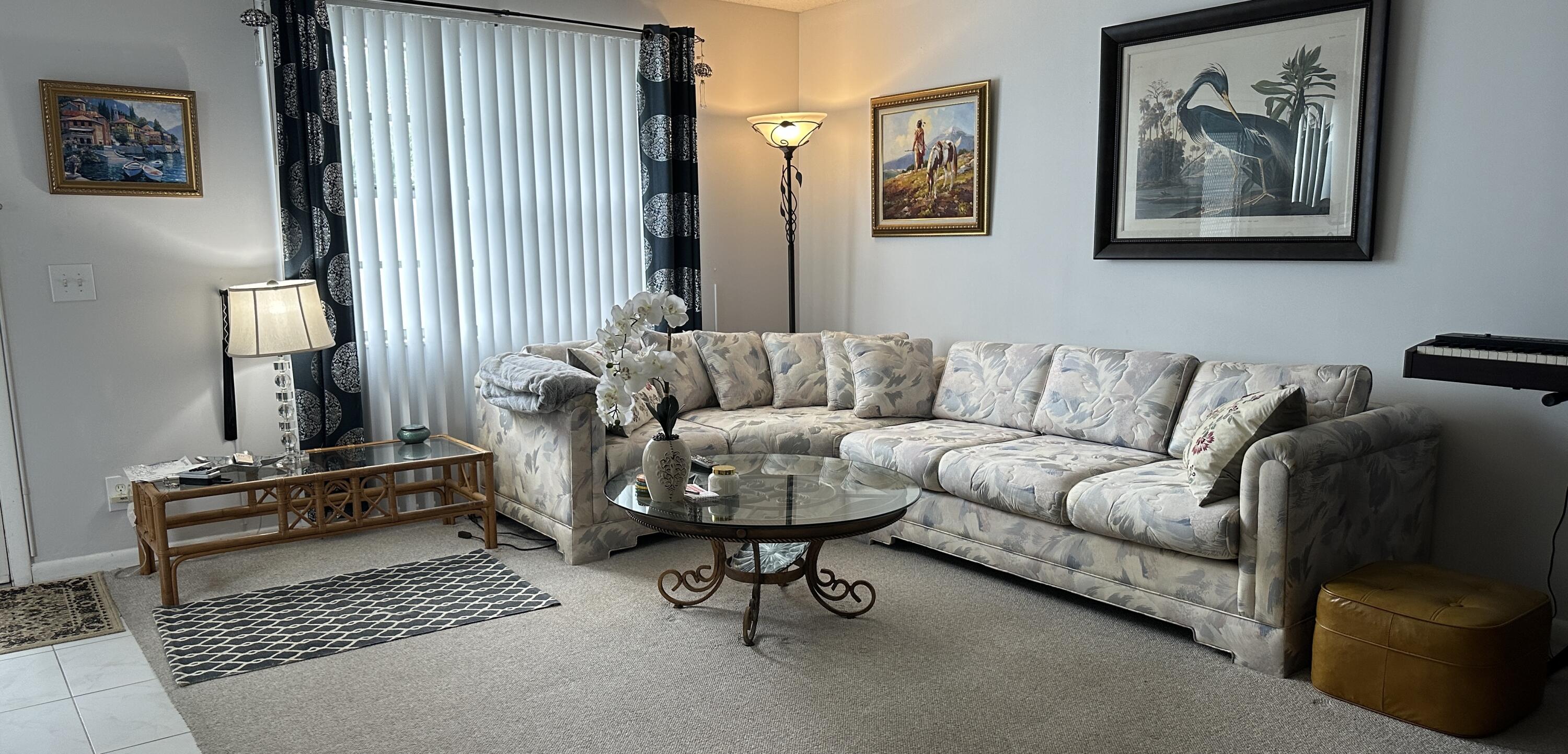 415 Saxony Way Delray Beach, FL 33446 - Photo 3 of 23 a living room with furniture and a rug