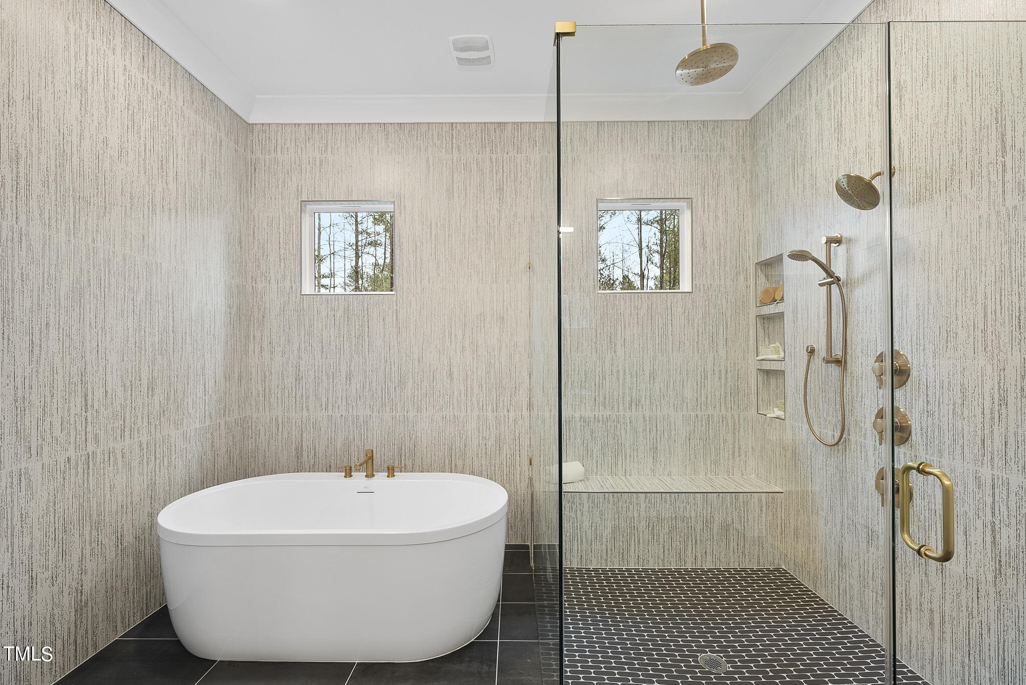 7820 Ailesbury Road Wake Forest, NC 27587 - Photo 12 of 35 a bathroom with a sink a shower and a mirror
