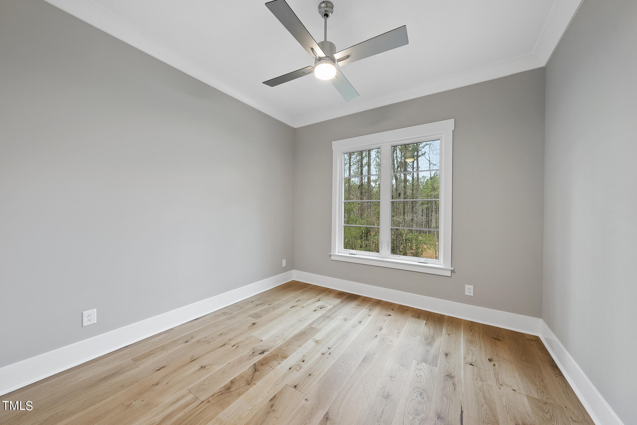 7820 Ailesbury Road Wake Forest, NC 27587 - Photo 15 of 35 an empty room with wooden floor and windows