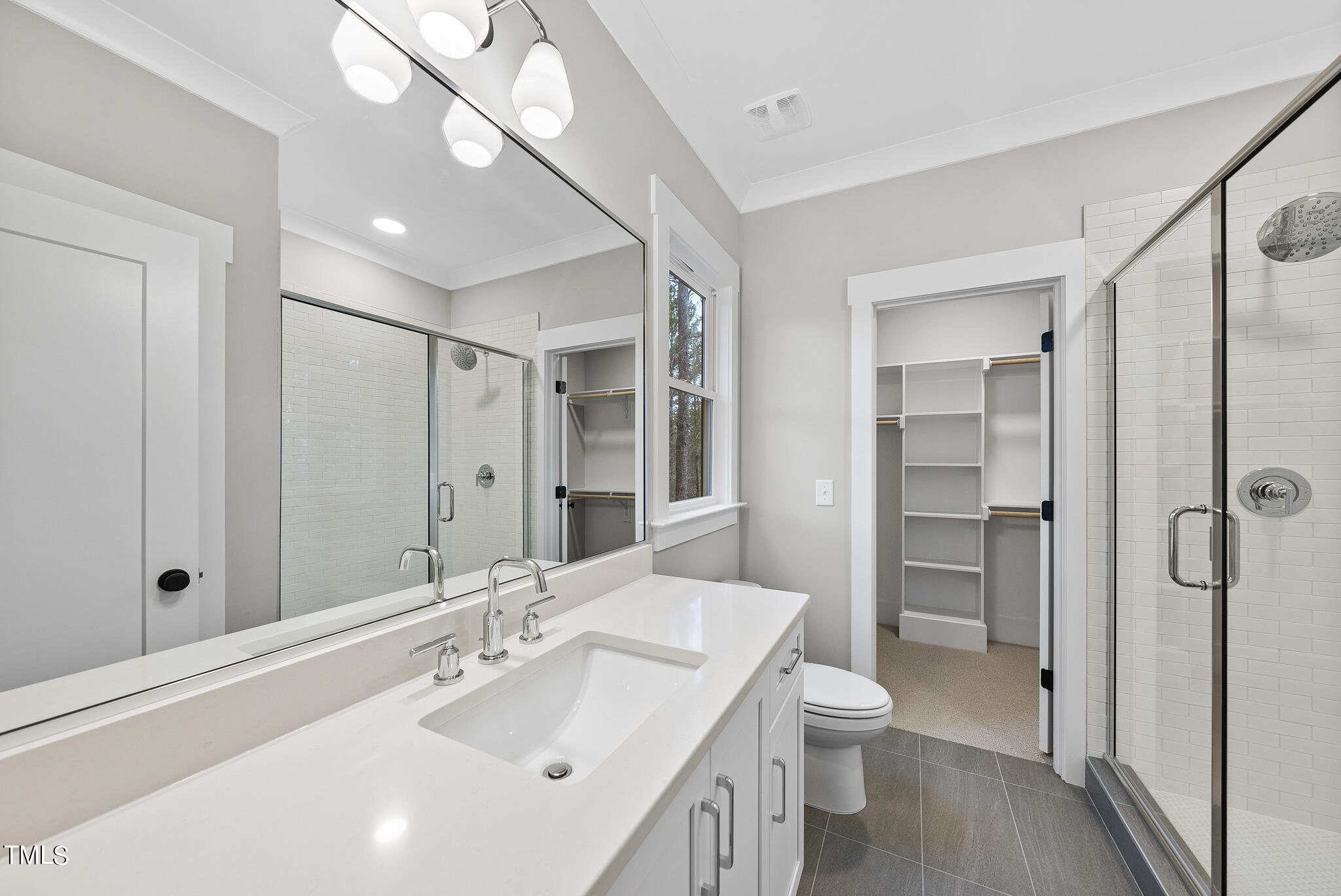 7820 Ailesbury Road Wake Forest, NC 27587 - Photo 18 of 35 a bathroom with a sink a toilet and shower