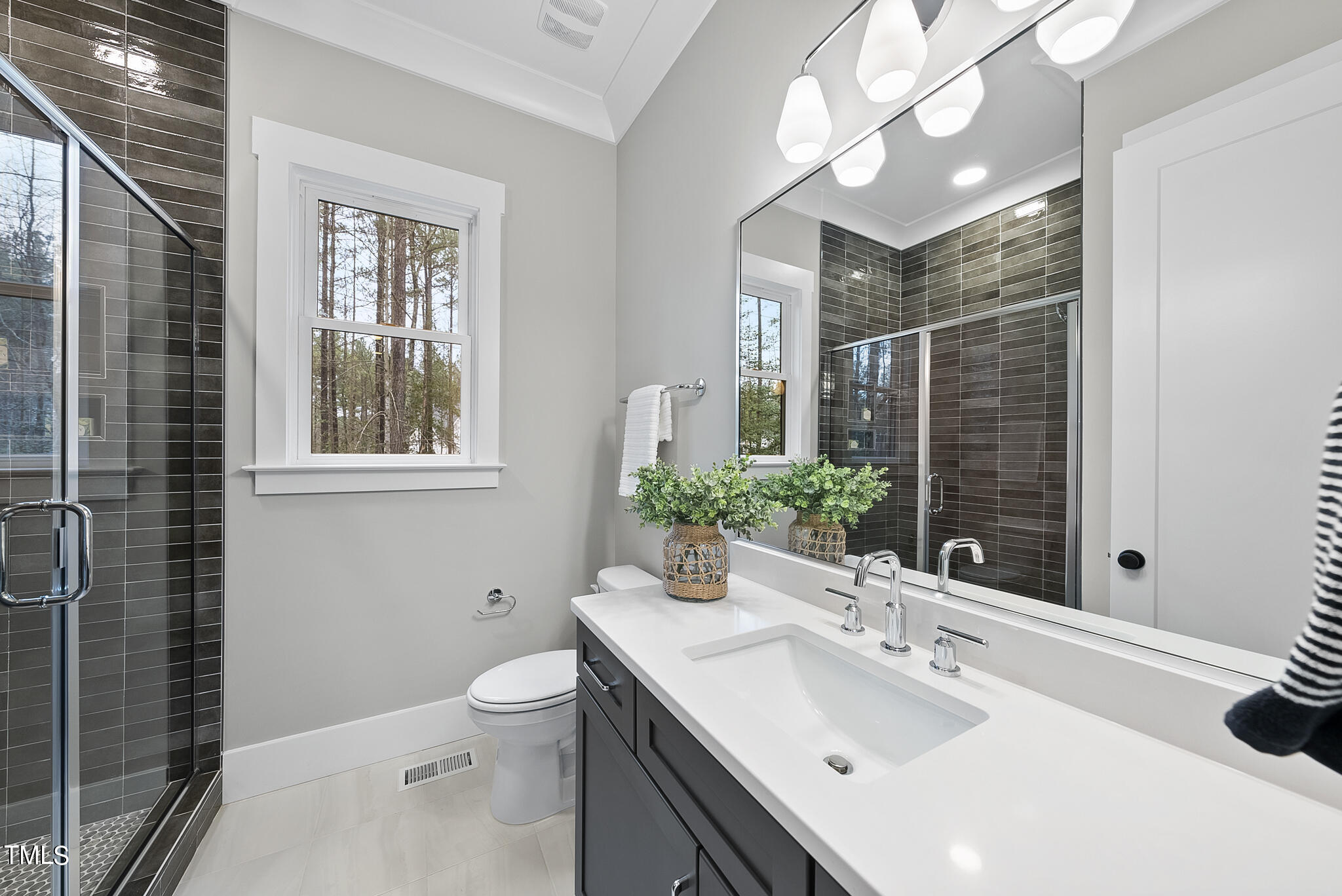 7820 Ailesbury Road Wake Forest, NC 27587 - Photo 20 of 35 a bathroom with a sink toilet and shower