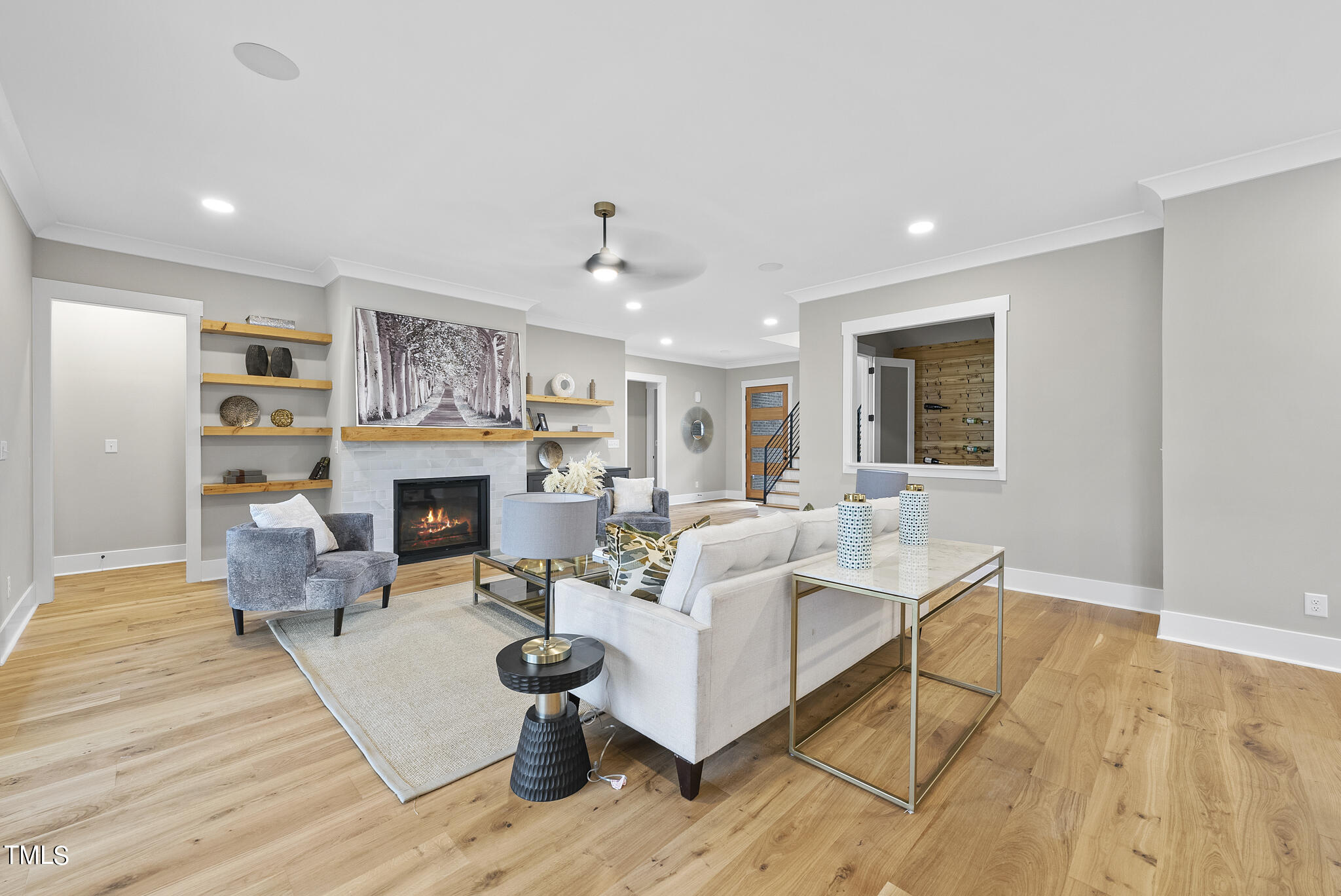 7820 Ailesbury Road Wake Forest, NC 27587 - Photo 21 of 35 a living room with furniture and a fireplace
