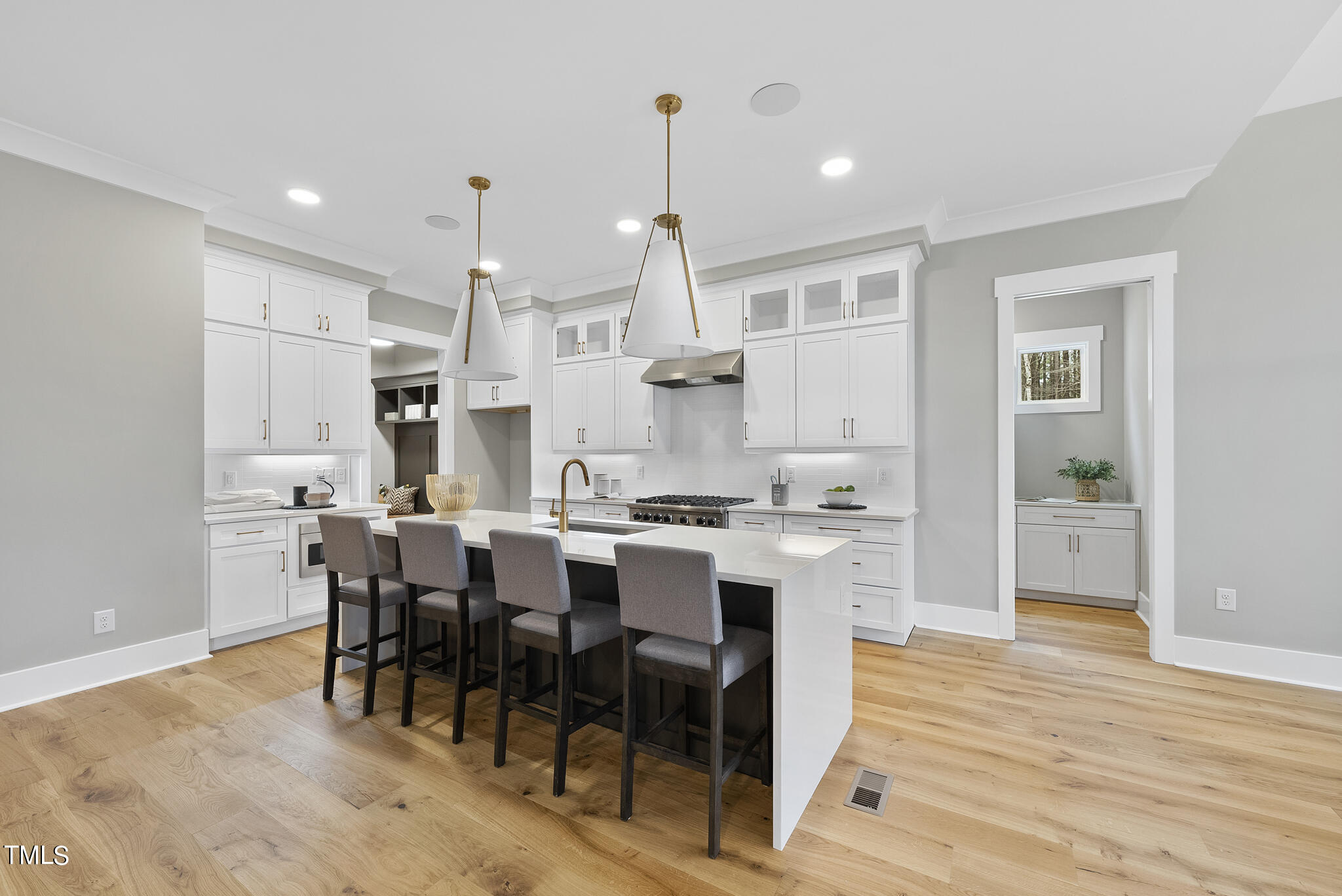 7820 Ailesbury Road Wake Forest, NC 27587 - Photo 25 of 35 a large kitchen with a table and chairs