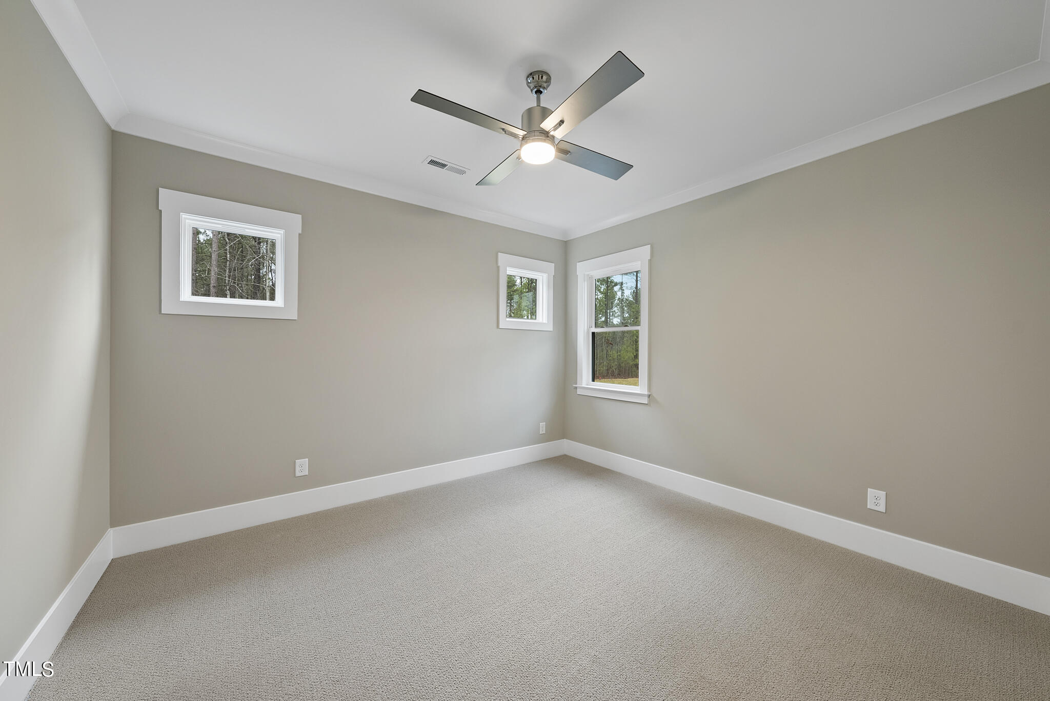 7820 Ailesbury Road Wake Forest, NC 27587 - Photo 27 of 35 an empty room with a window and a ceiling fan
