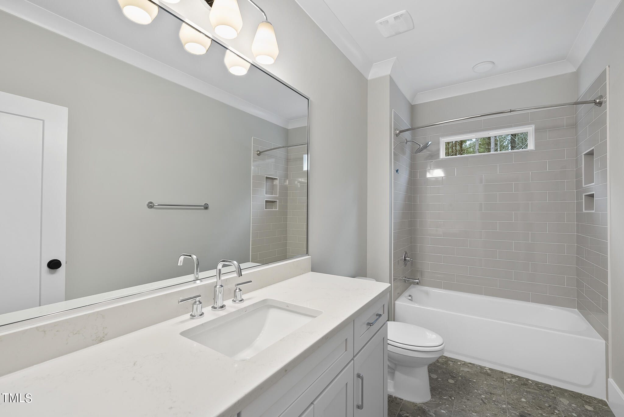 7820 Ailesbury Road Wake Forest, NC 27587 - Photo 34 of 35 a bathroom with a sink a toilet a mirror and bathtub