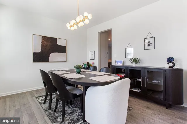 a dining room with a table and chairs