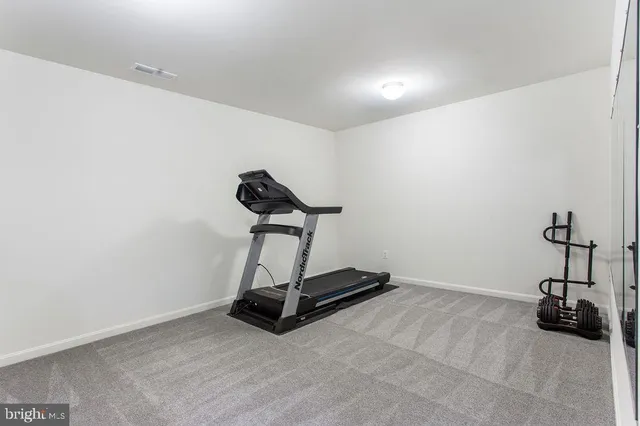 a room with a table and a potted plant