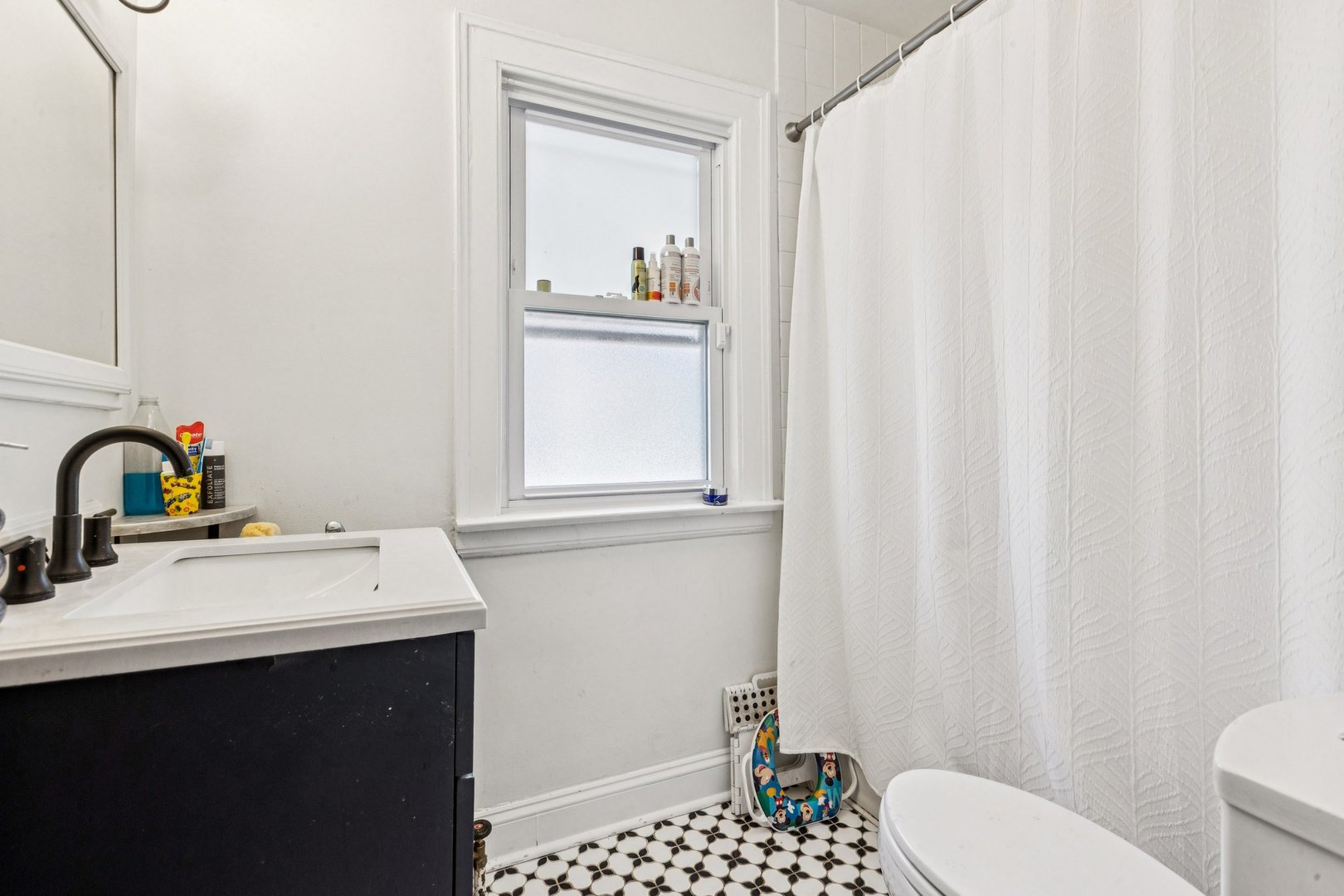 1656 Harding Road Northfield, IL 60093 - Photo 11 of 14 a bathroom with a sink a toilet and shower