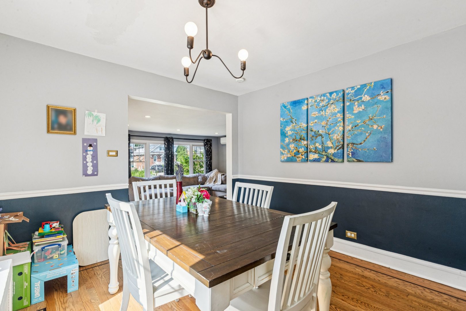 1656 Harding Road Northfield, IL 60093 - Photo 6 of 14 a view of a dining room with furniture a chandelier and wooden floor