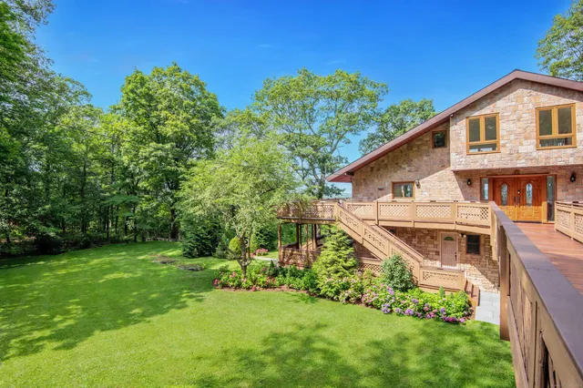 a aerial view of a house with a yard