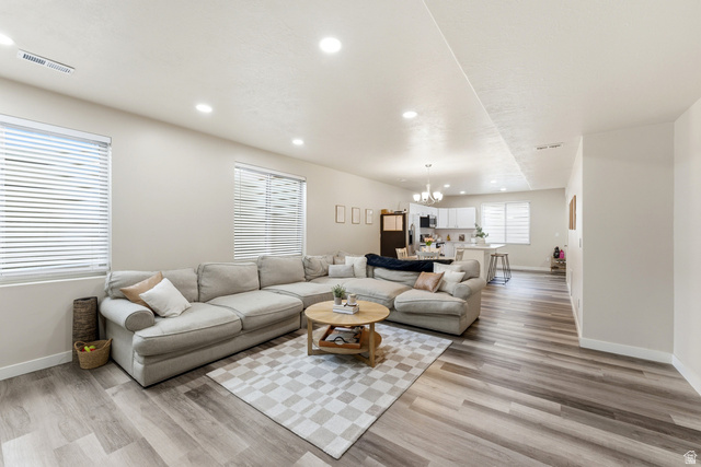 1434 West Stable Street Lindon, UT 84042 - Photo 35 of 76 Living area with light wood finished floors and hanging lights