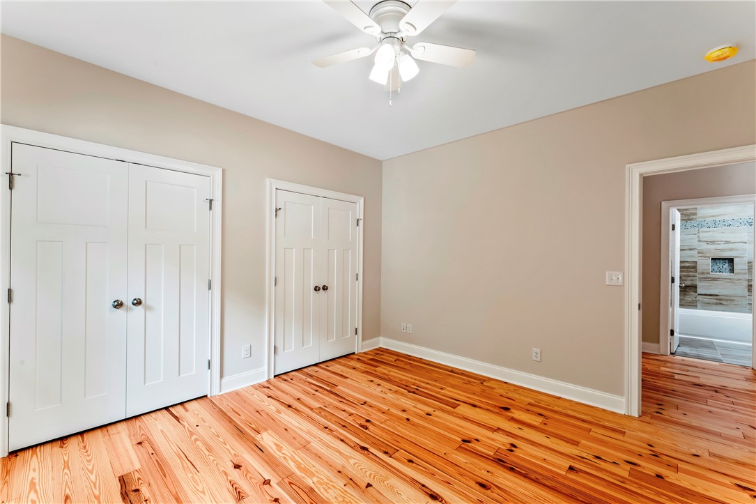 110 Gabriel Way Pickens, SC 29671 - Photo 24 of 48 Hardwood floors and a pristine primary bathroom access create an inviting retreat.