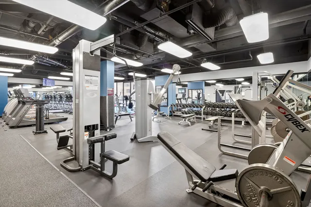 a work room with furniture and flat screen tv