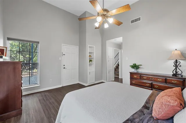 a bedroom with a bed dresser and a window
