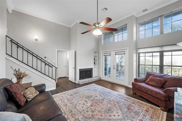 a living room with furniture ceiling fan and a rug
