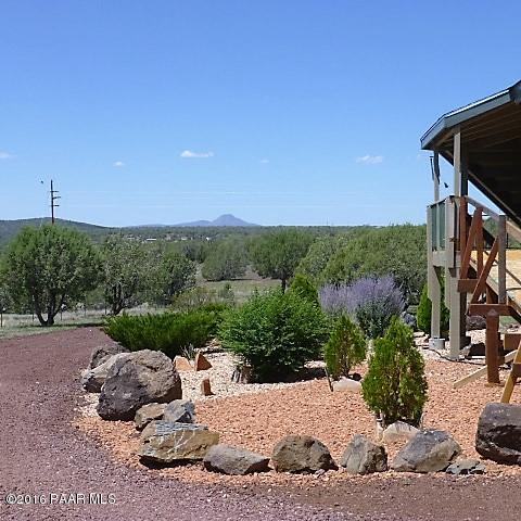 3229 Double A Ranch Road Williams, AZ 86046 - Photo 20 of 38 a backyard of a house with lots of green space