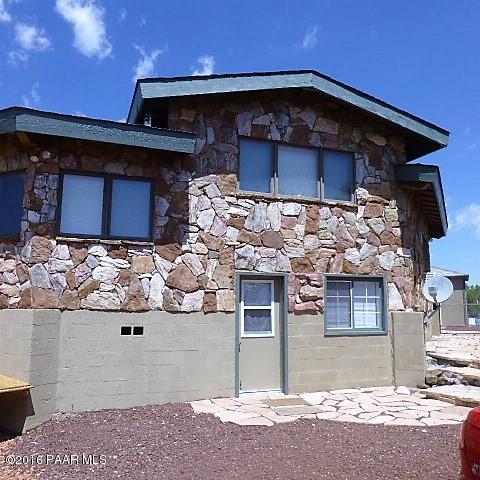 3229 Double A Ranch Road Williams, AZ 86046 - Photo 2 of 38 a view of a house with a garage