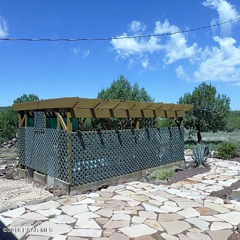 3229 Double A Ranch Road Williams, AZ 86046 - Photo 22 of 38 a view of a backyard with a wooden fence
