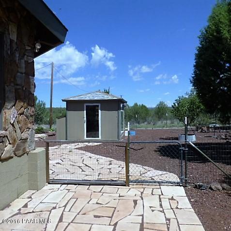 3229 Double A Ranch Road Williams, AZ 86046 - Photo 4 of 38 a front view of a house with a yard
