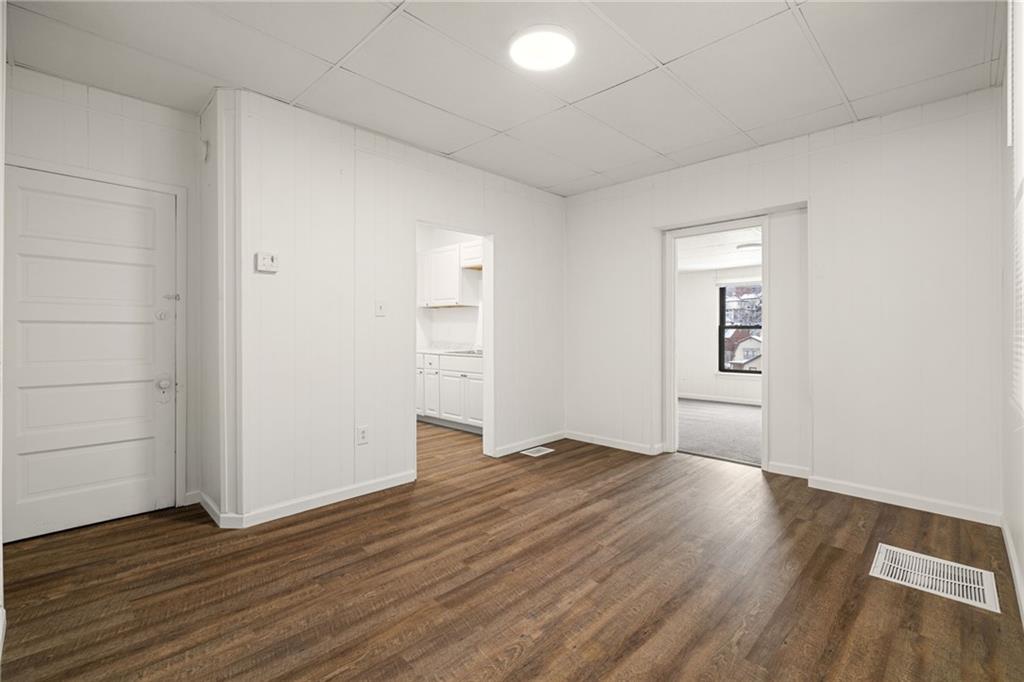 62 Maytide Street Pittsburgh, PA 15227 - Photo 5 of 23 an empty room with wooden floor and windows