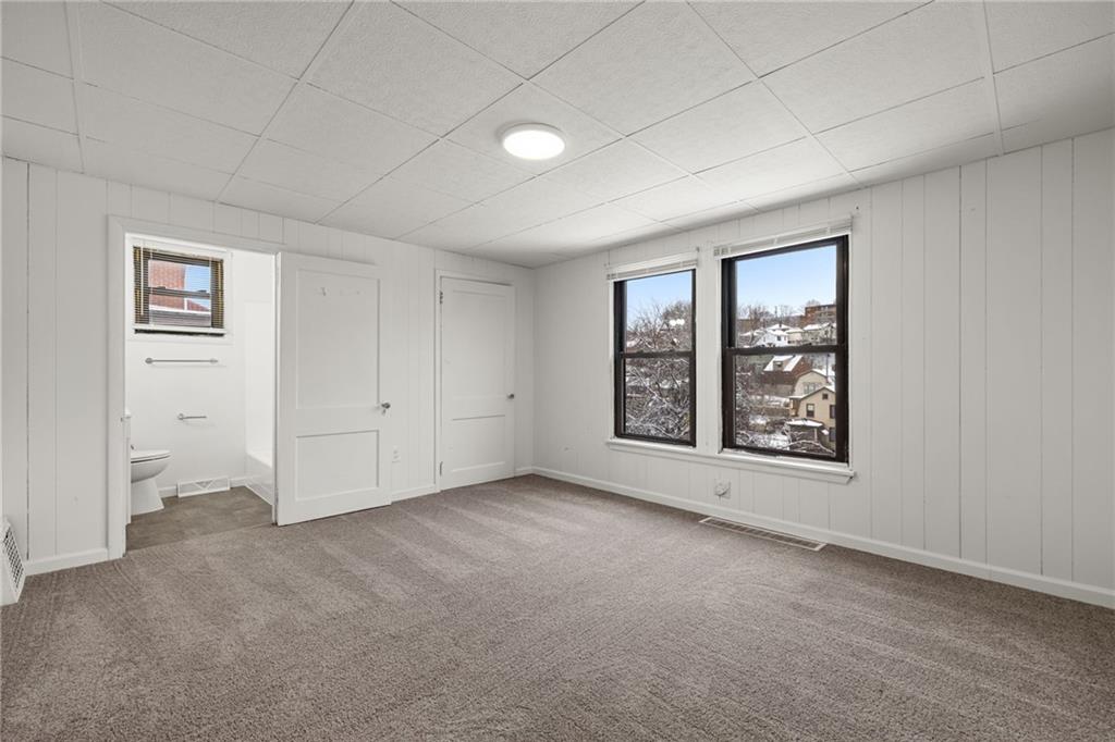 62 Maytide Street Pittsburgh, PA 15227 - Photo 8 of 23 an empty room with windows and closet