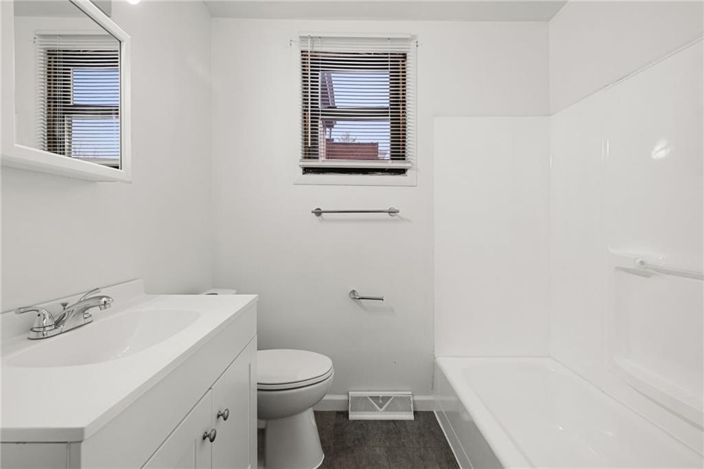 62 Maytide Street Pittsburgh, PA 15227 - Photo 10 of 23 a bathroom with a sink toilet and vanity