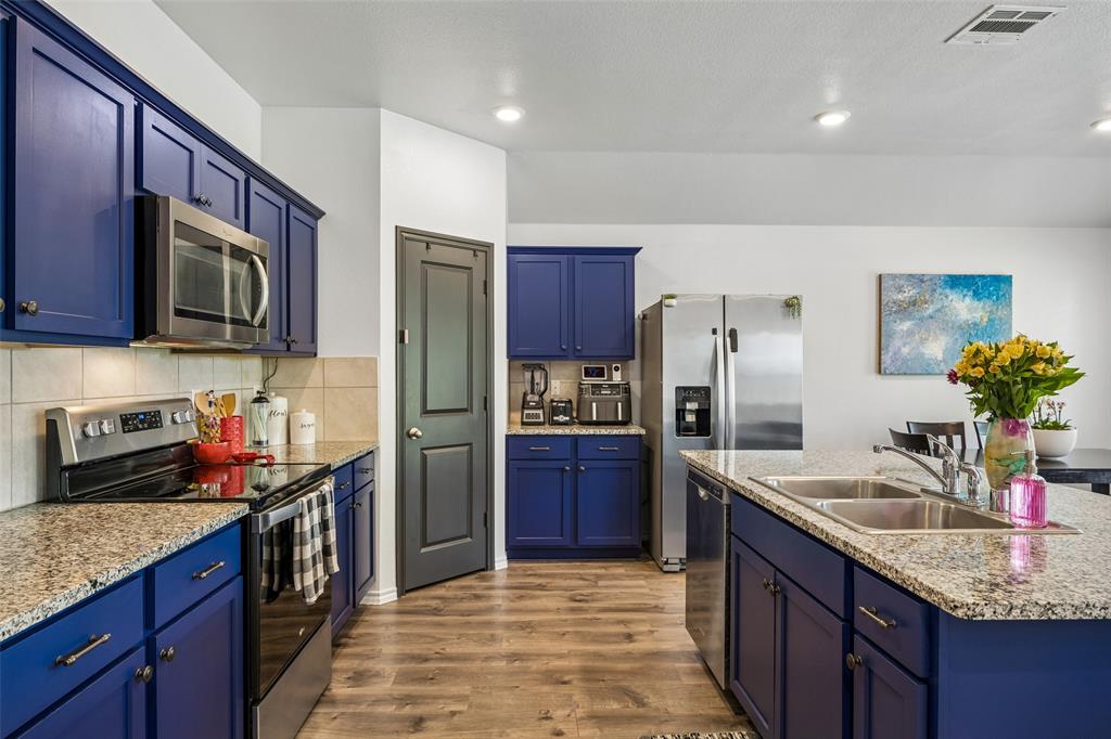 802 Rustic Way Royse City, TX 75189 - Photo 2 of 38 a kitchen with stainless steel appliances granite countertop a sink stove and refrigerator