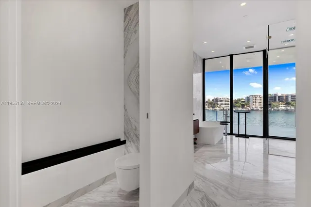 a view of a hallway with windows