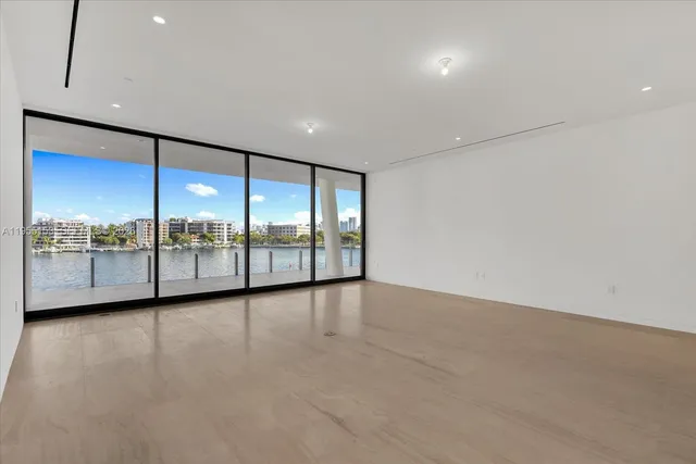 an empty room with large window