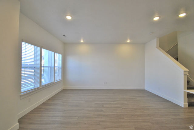 1219 West 1870 South Logan, UT 84321 - Photo 2 of 18 Living Room with light wood-style flooring, recessed lighting, and stairway