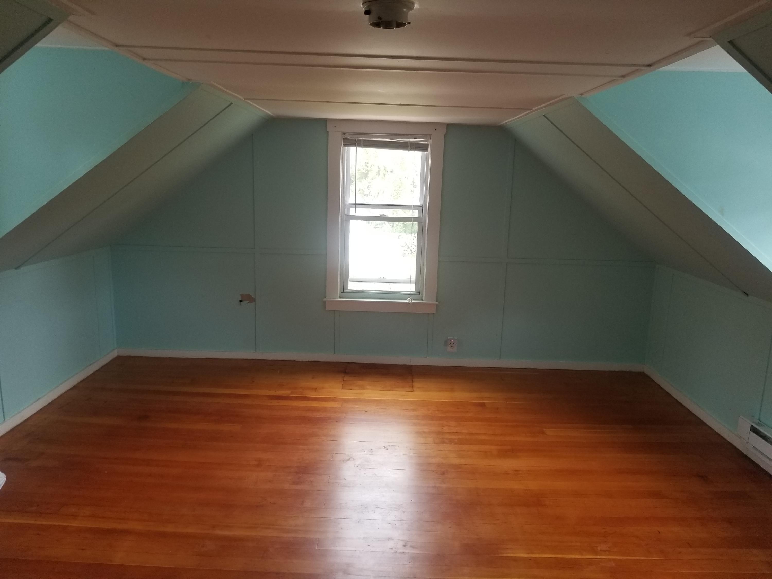 85 Shore Road Bourne, MA 02532 - Photo 11 of 16 an empty room with wooden floor and windows