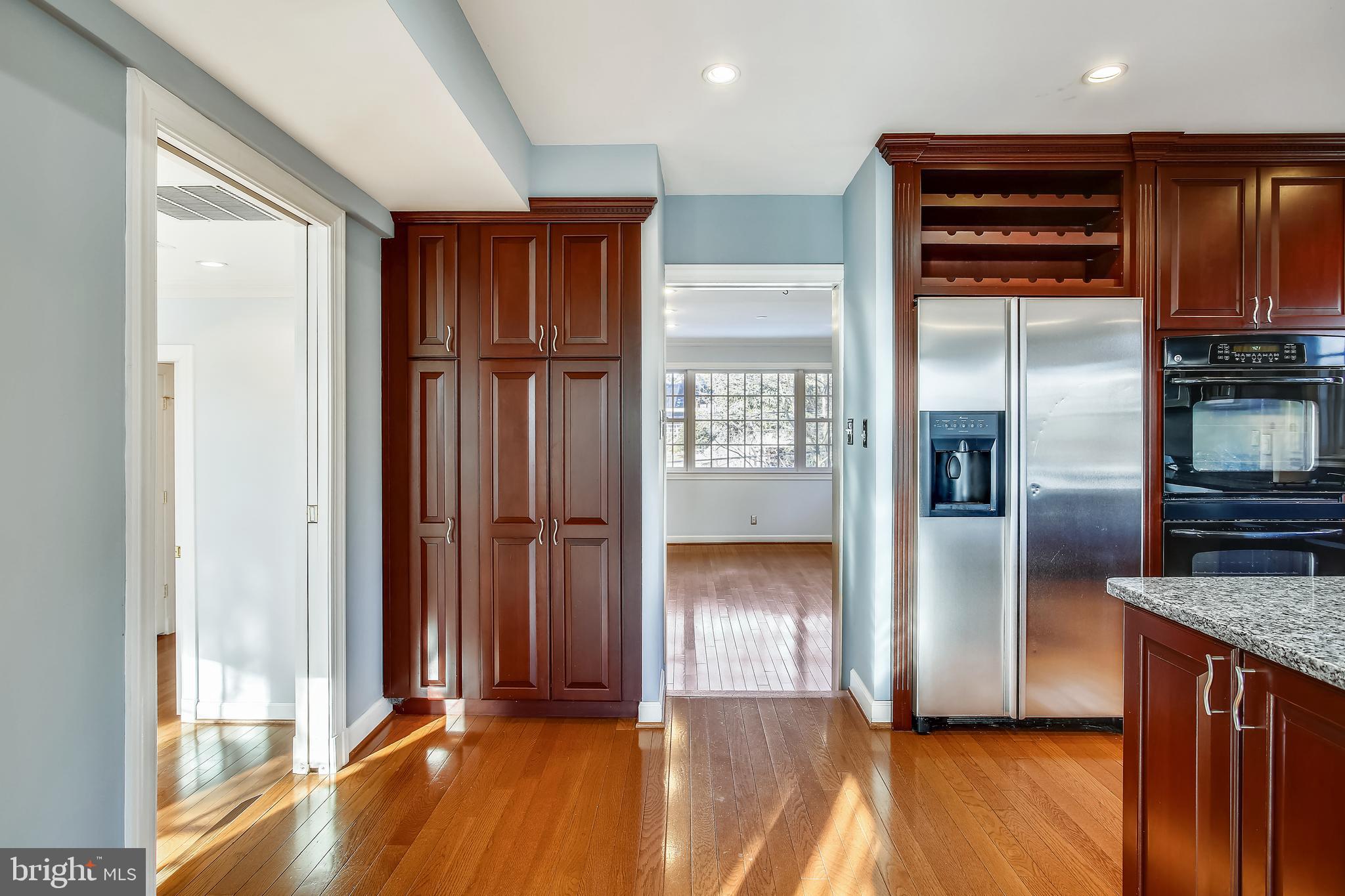4664 Reservoir Road Northwest Washington, DC 20007 - Photo 12 of 60 a kitchen with stainless steel appliances granite countertop a refrigerator and a sink