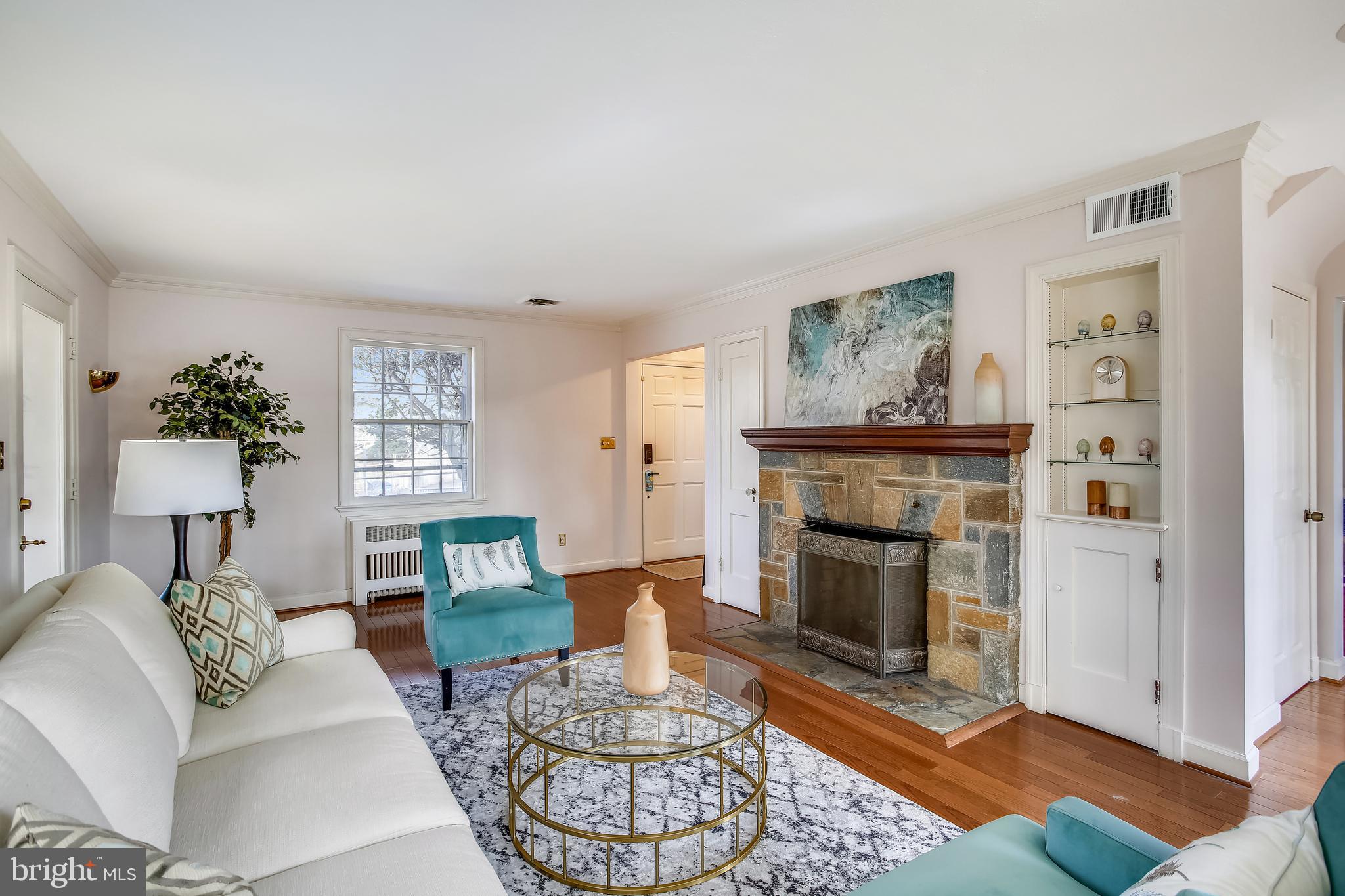 4664 Reservoir Road Northwest Washington, DC 20007 - Photo 14 of 60 a living room with furniture and a fireplace