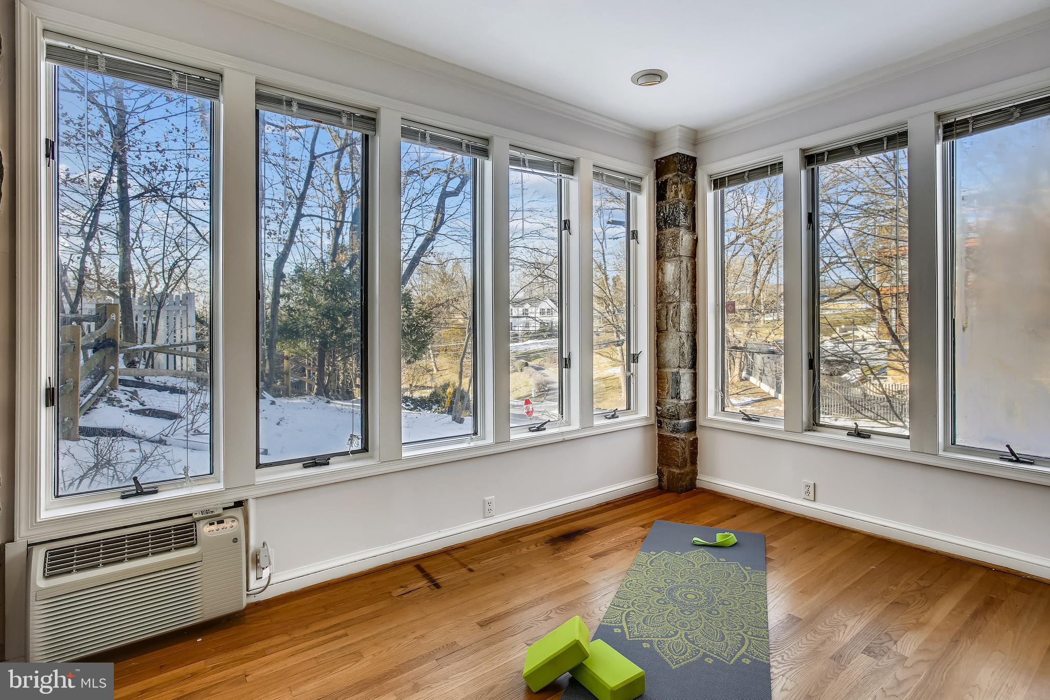 4664 Reservoir Road Northwest Washington, DC 20007 - Photo 18 of 60 a view of an empty room with a window and wooden floor