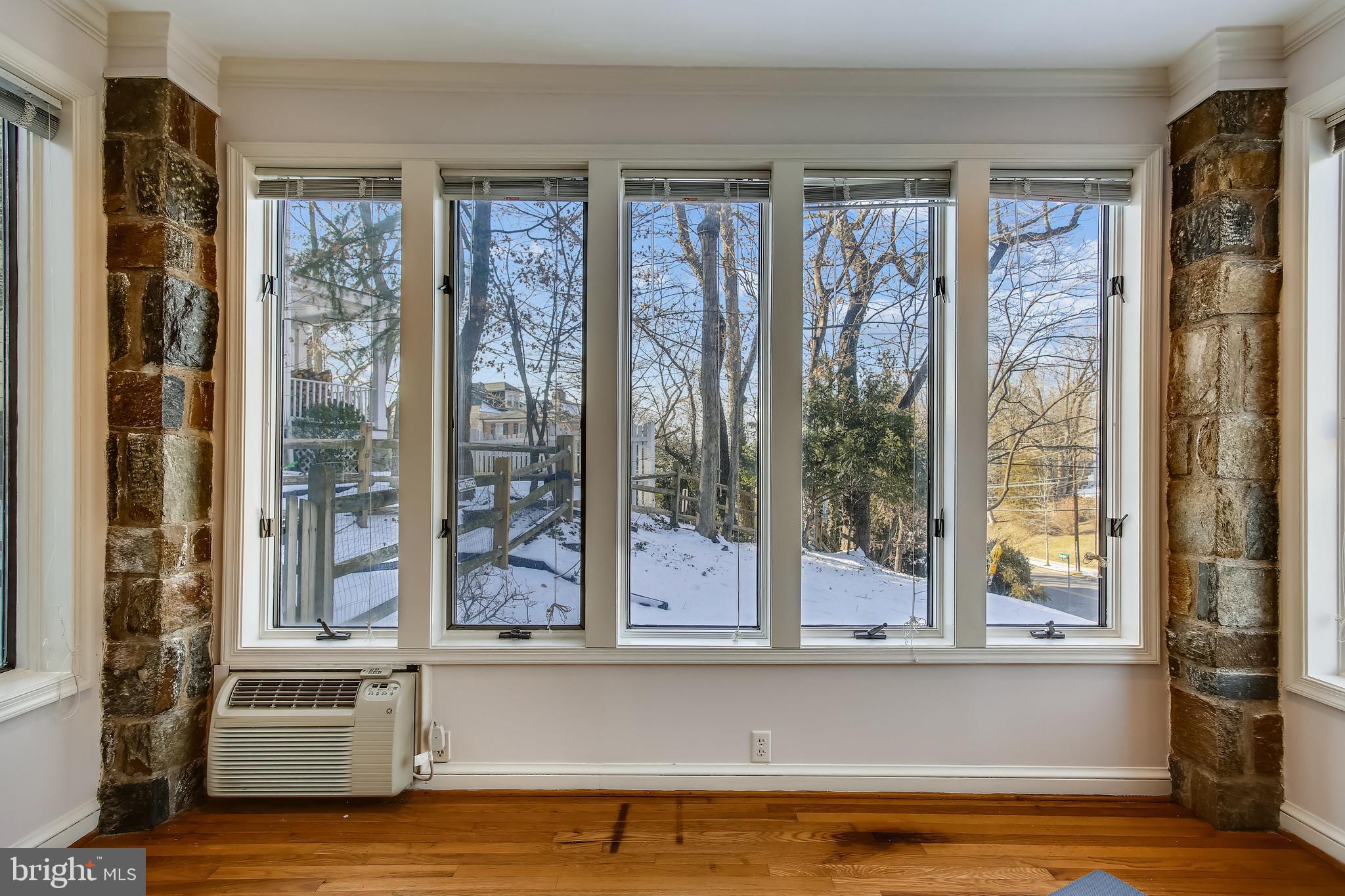 4664 Reservoir Road Northwest Washington, DC 20007 - Photo 19 of 60 a living room with a large window and wooden floor
