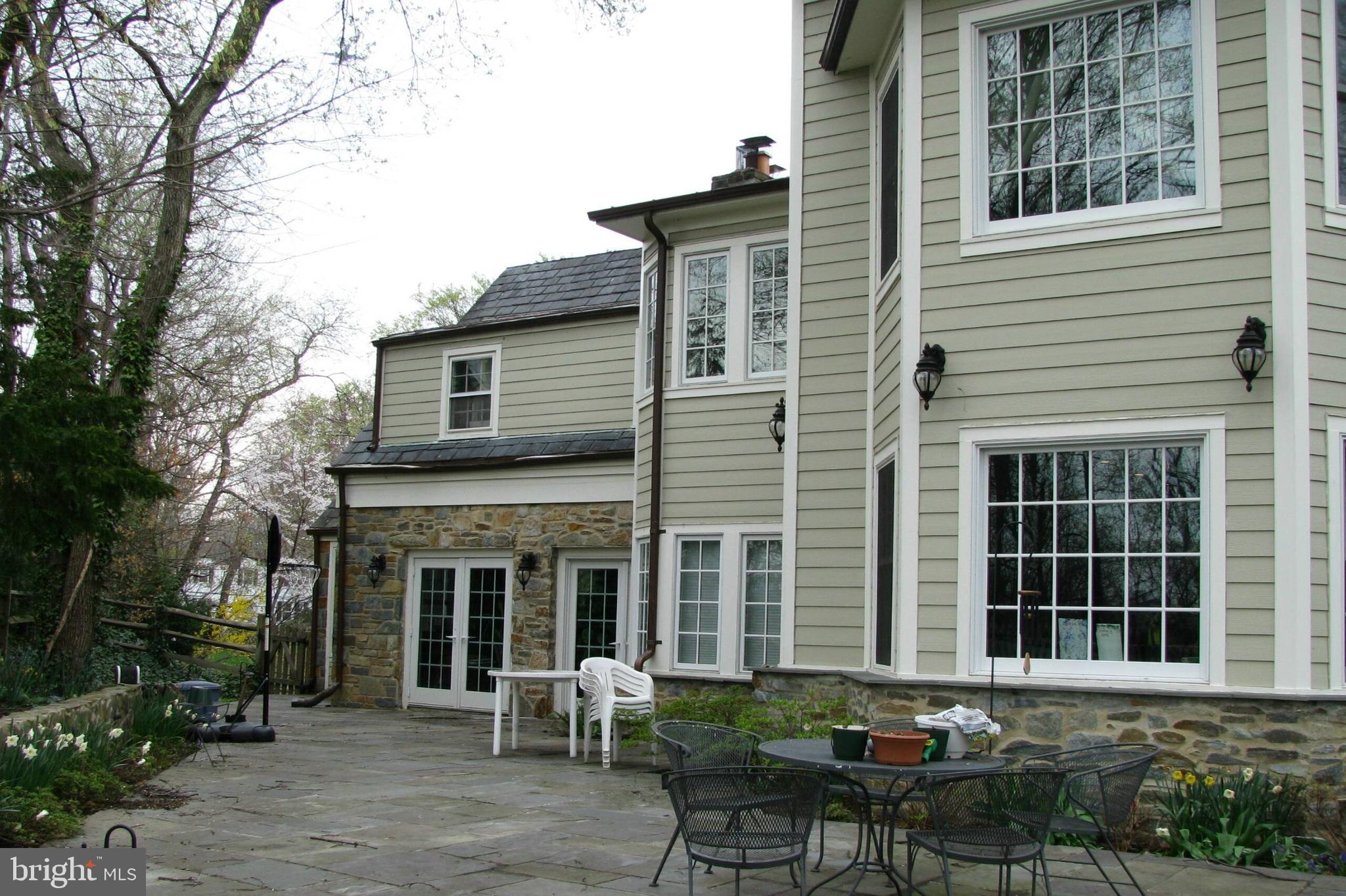 4664 Reservoir Road Northwest Washington, DC 20007 - Photo 3 of 60 a view of a house with a yard and sitting area