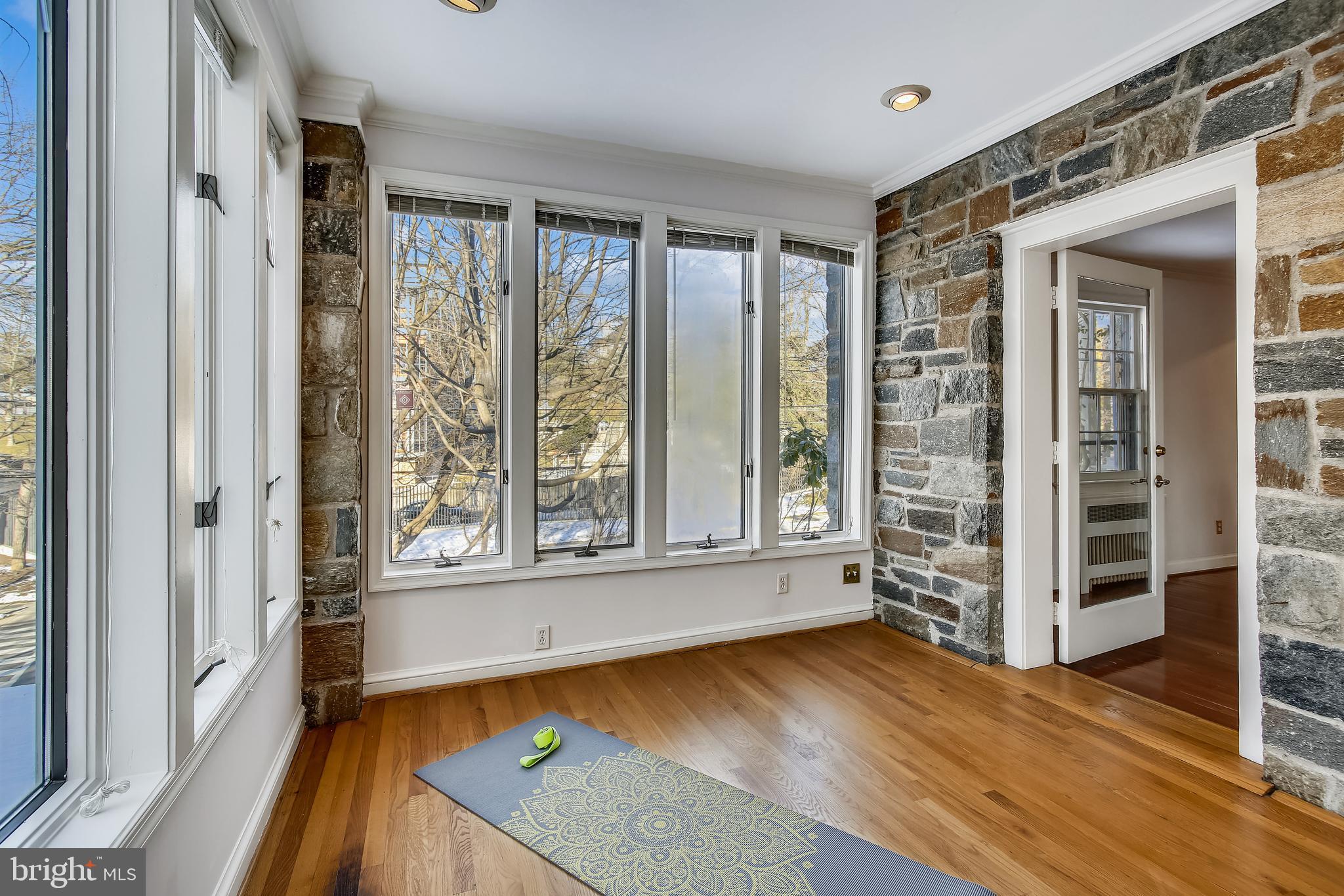 4664 Reservoir Road Northwest Washington, DC 20007 - Photo 21 of 60 wooden floor in an empty room with a window