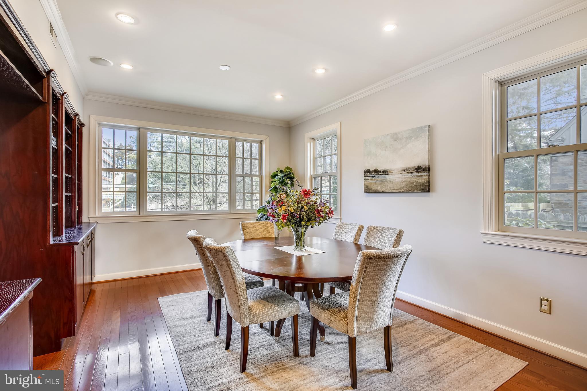 4664 Reservoir Road Northwest Washington, DC 20007 - Photo 24 of 60 a view of a dining room with furniture window and wooden floor