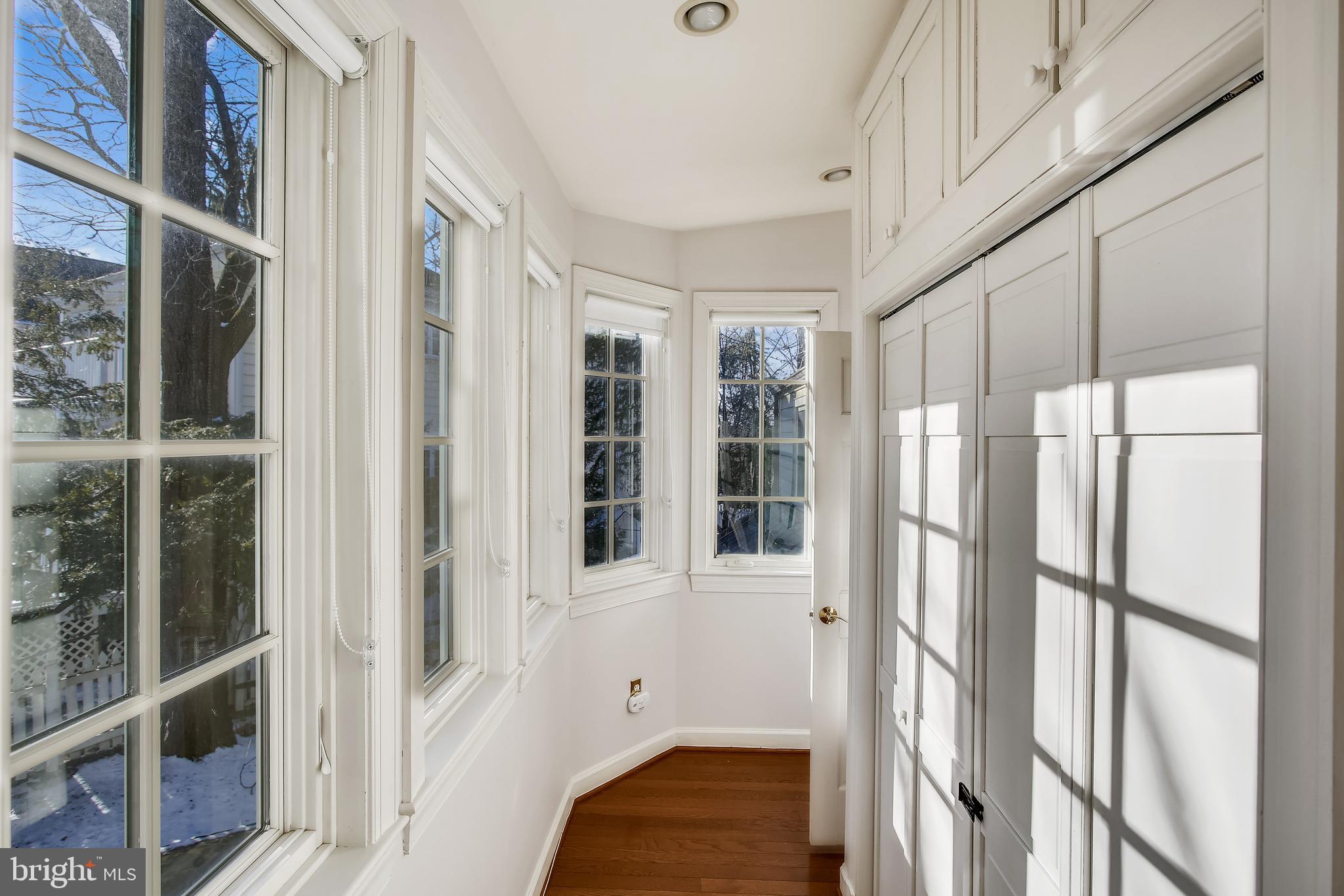 4664 Reservoir Road Northwest Washington, DC 20007 - Photo 28 of 60 a view of small space with wooden floor and windows