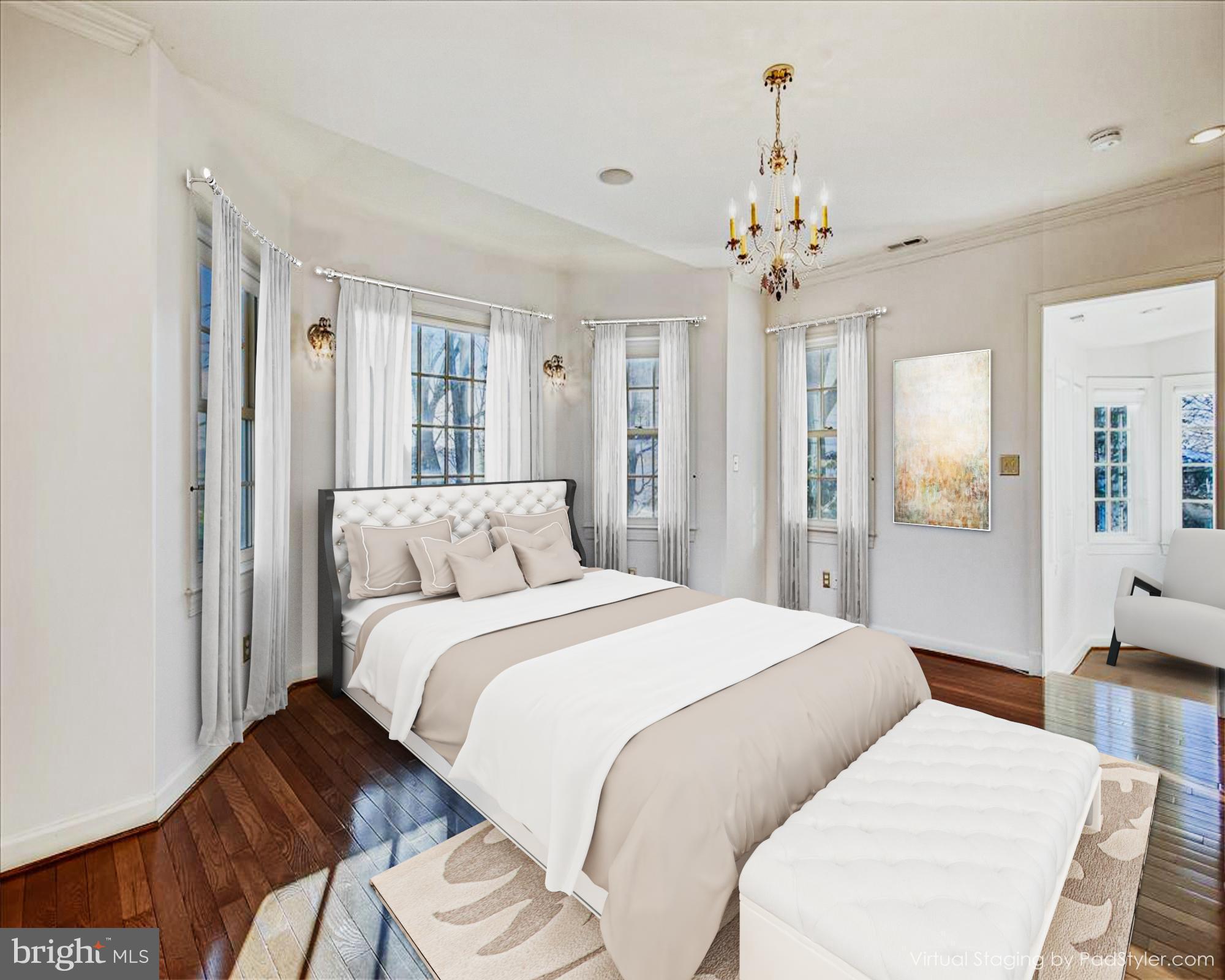 4664 Reservoir Road Northwest Washington, DC 20007 - Photo 31 of 60 a spacious bedroom with two beds and a chandelier