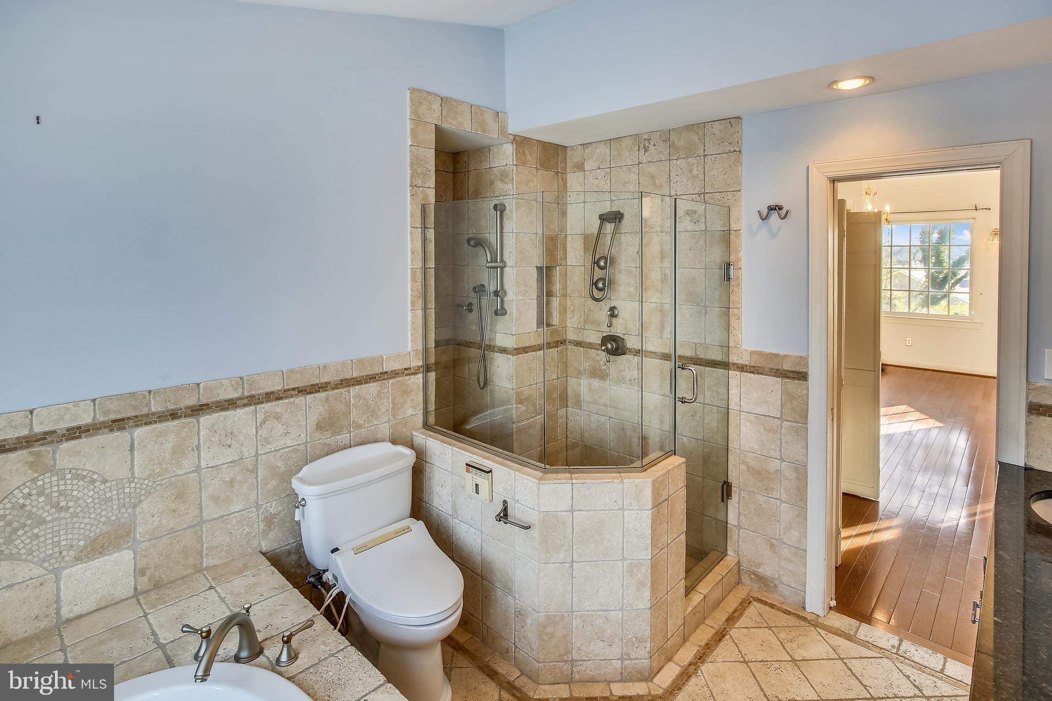 4664 Reservoir Road Northwest Washington, DC 20007 - Photo 33 of 60 a bathroom with a toilet and a shower